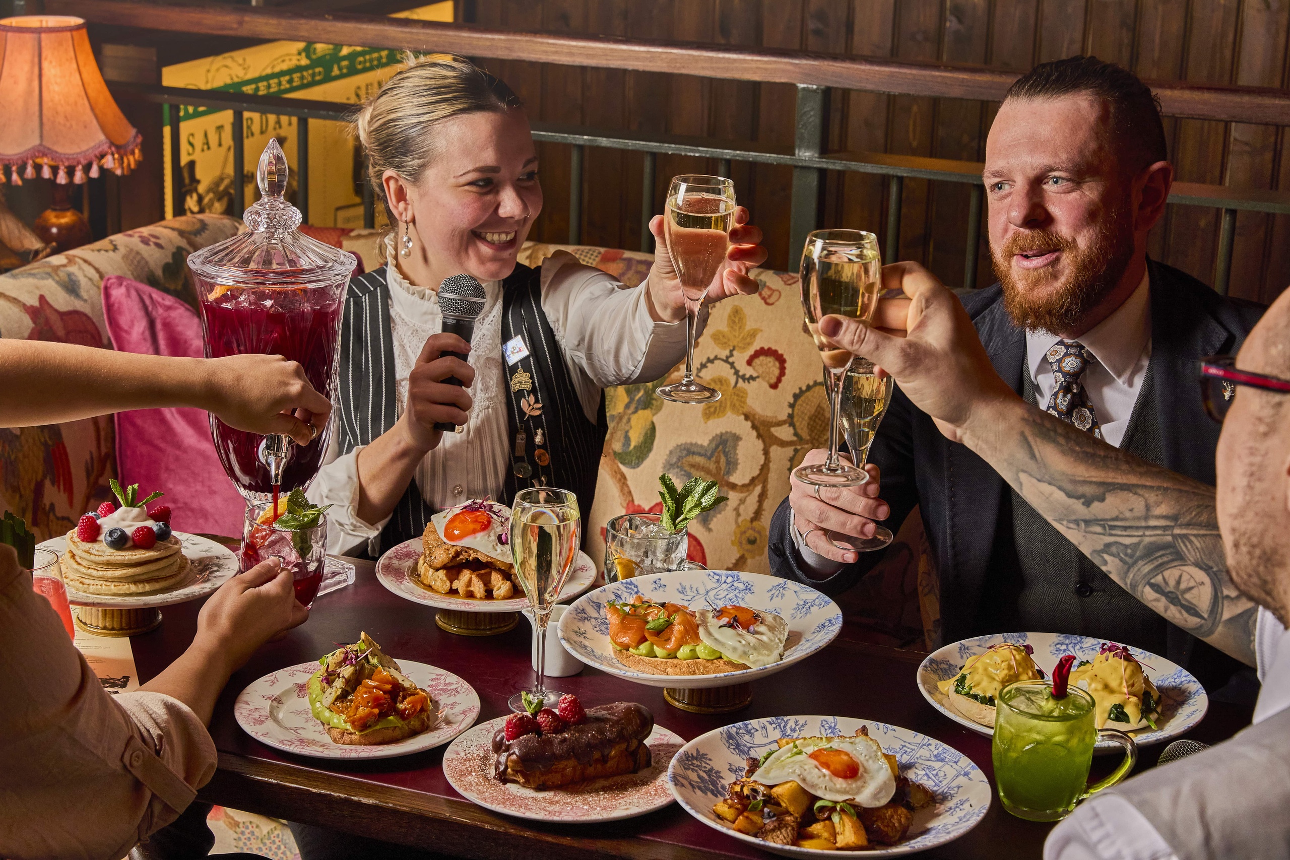 A group of people enjoy the Live Music Brunch at Mr Fogg's