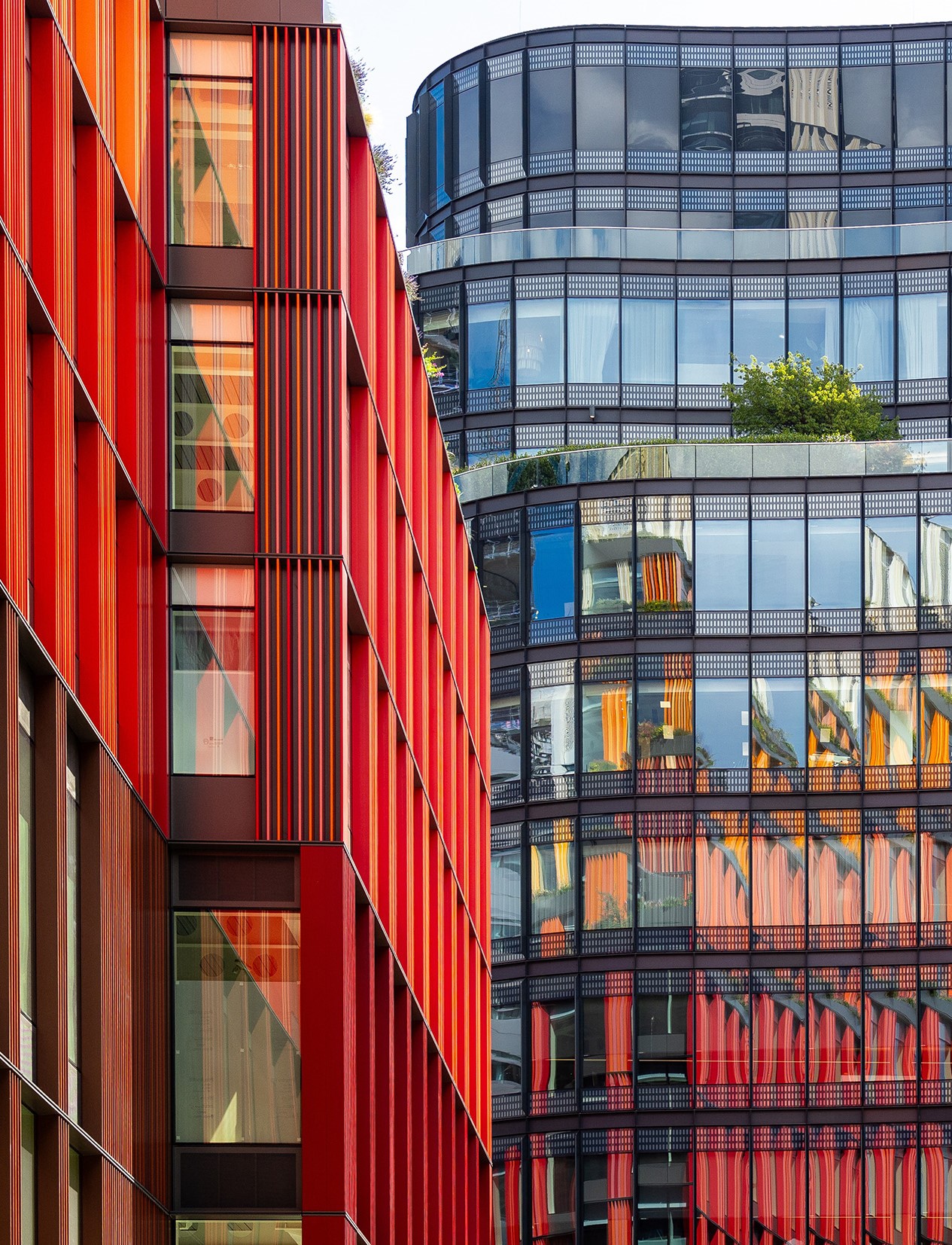 Broadgate reflected in 100 Liverpool Street glass façade, London