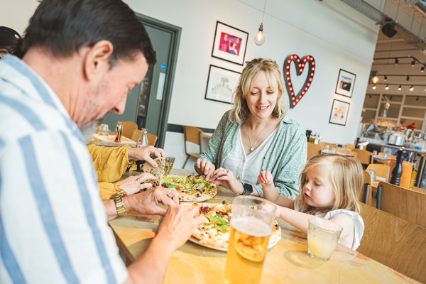 A family dining together at Franco Manca, Plymouth.