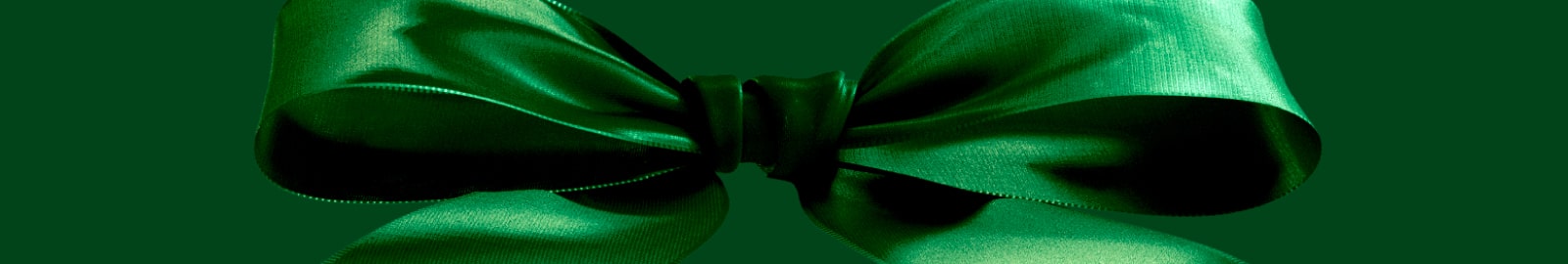 Green bow on green background