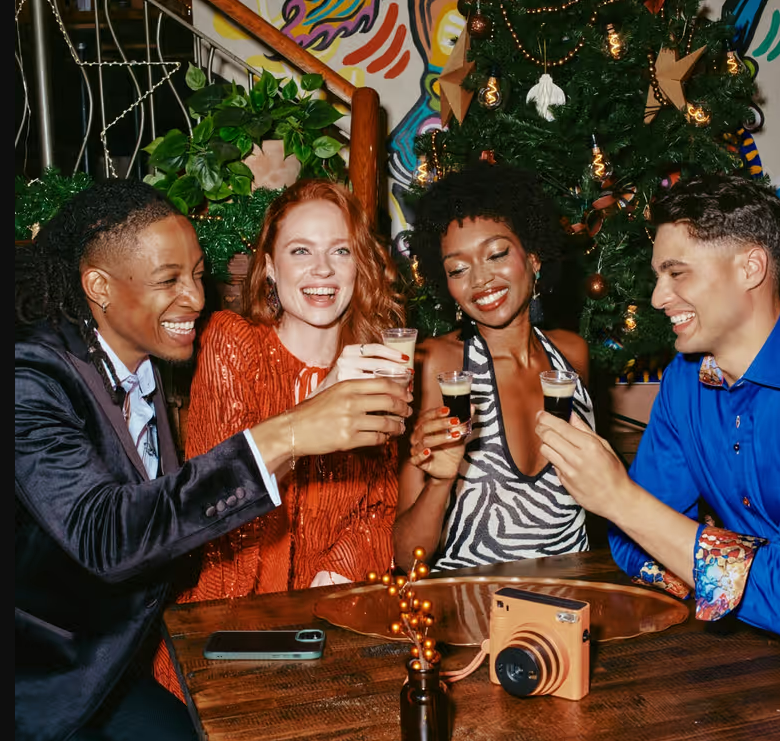 A group of people cheering at Zizzi