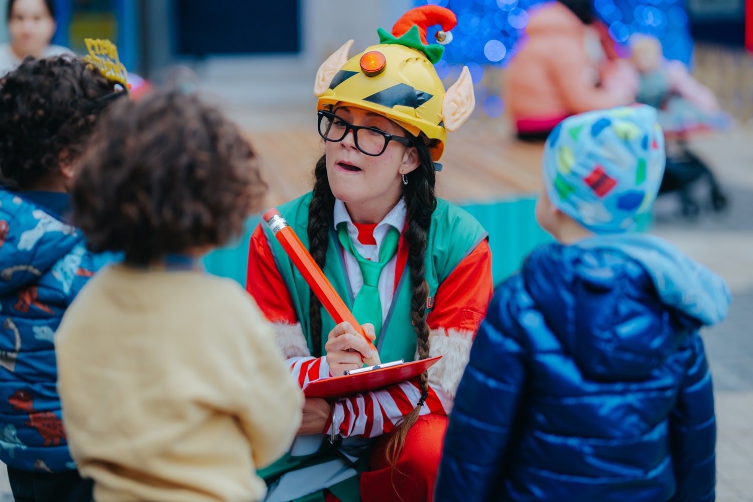 A Christmas elf with three children