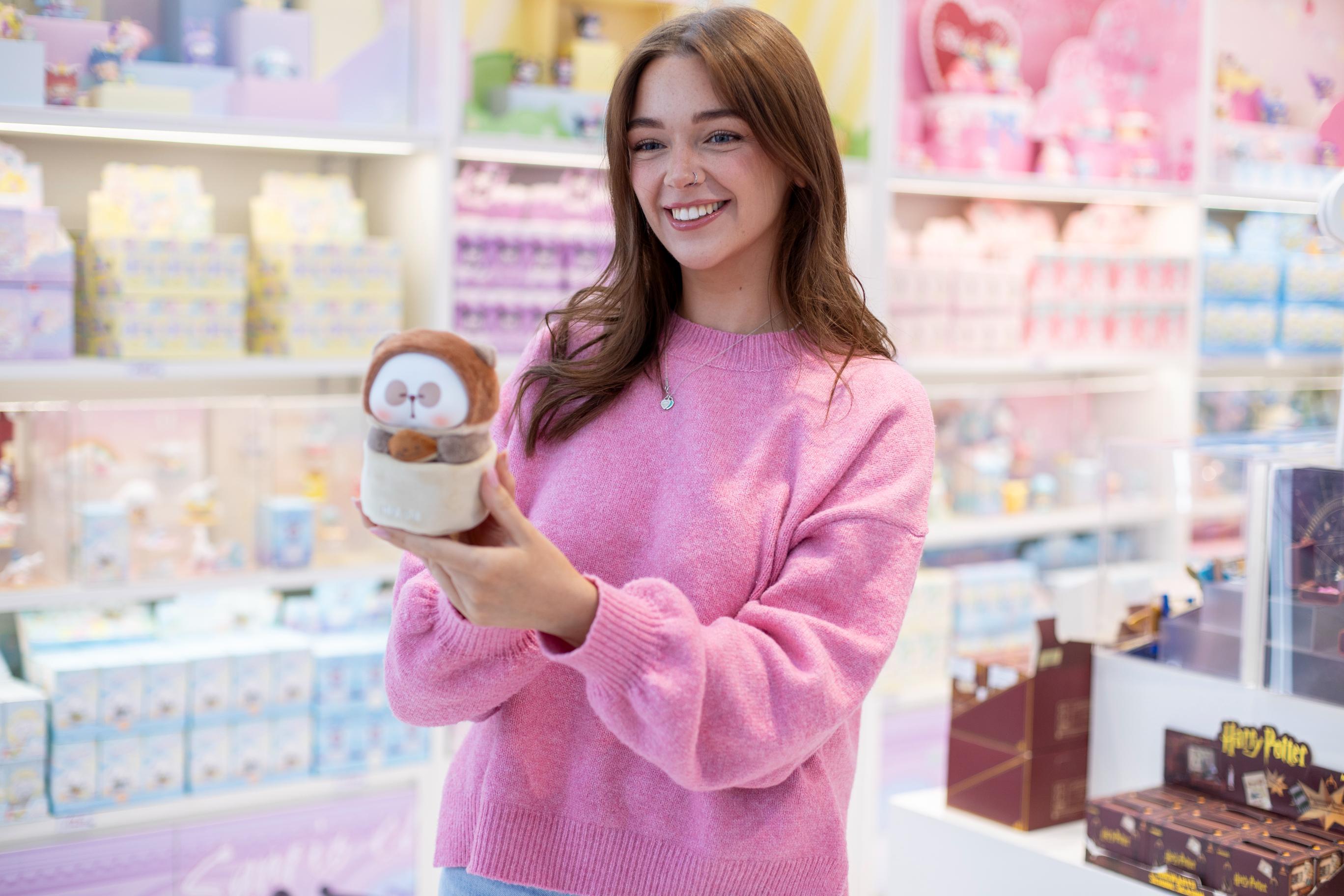 This is a promotional banner, likely from the website of MINISO, a global retailer specializing in low-cost, high-quality household goods, cosmetics, stationery, and toys, often featuring character collaborations. The overall aesthetic is bright, colorful, and highly organized.