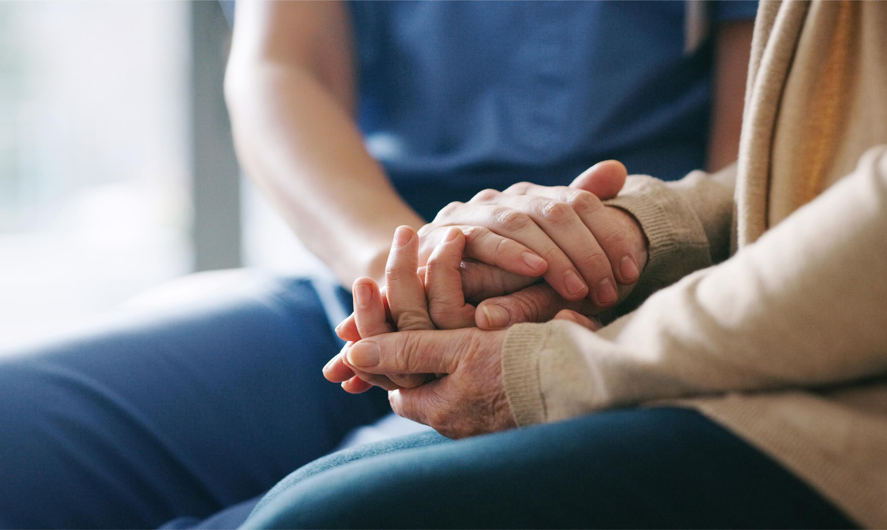 Close up of hands holding eachother