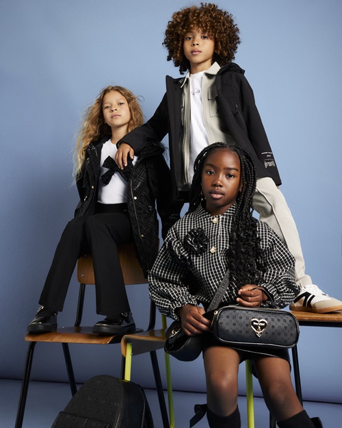 Children wearing back to school clothes from River Island