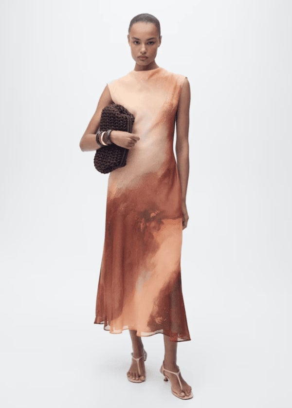 Woman wearing salmon coloured dress
