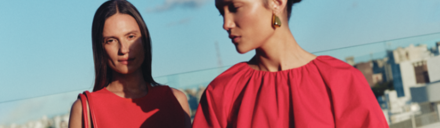 Two models wear red tops.