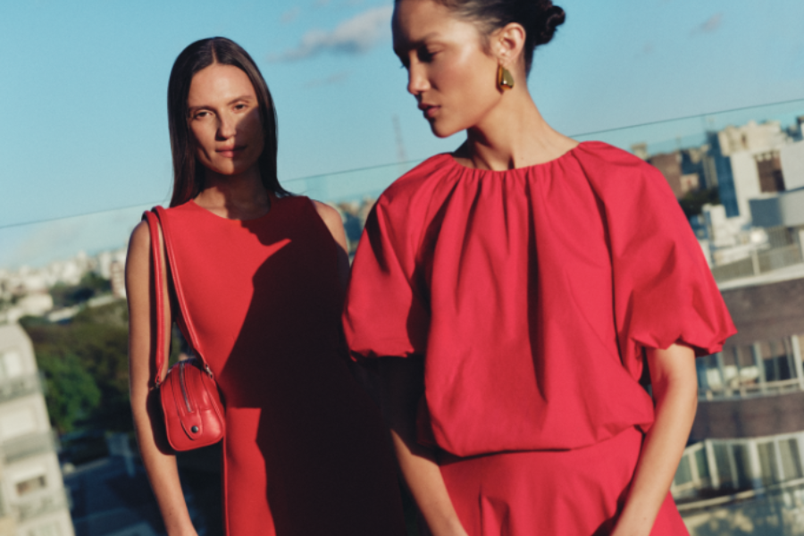 Two models wear red tops.