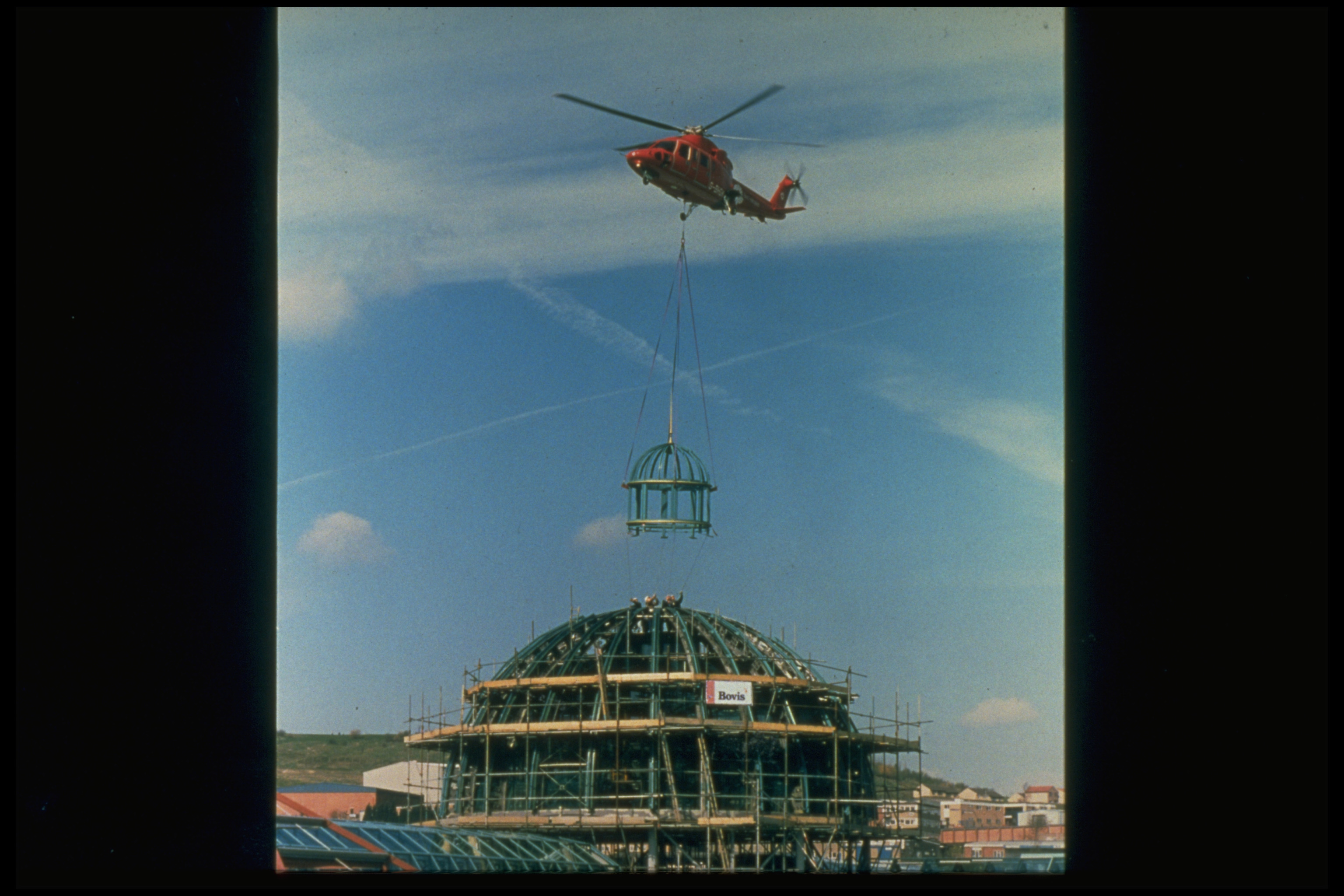 A helicopter places a part of the Meadowhall dome in place when the shopping centre is constructed in 1990