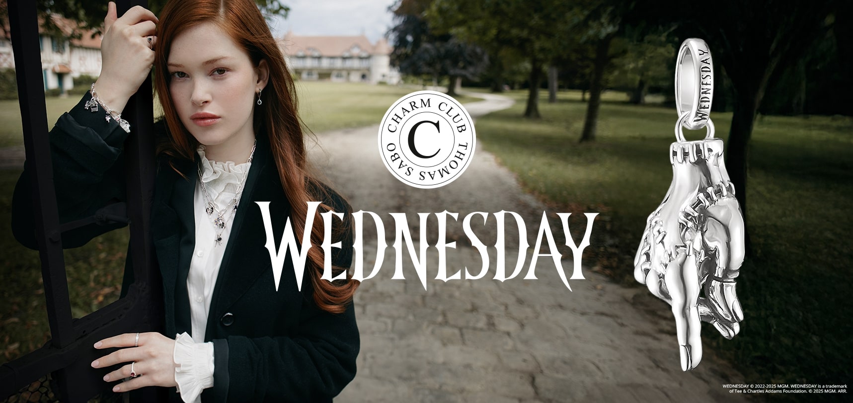 Red haired woman in black suit alongside Wednesday logo
