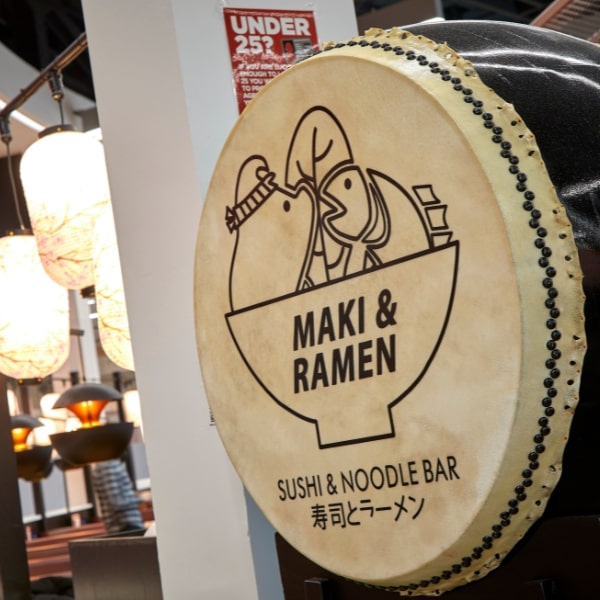 Close up of drum skin with maki and ramen text enbossed 