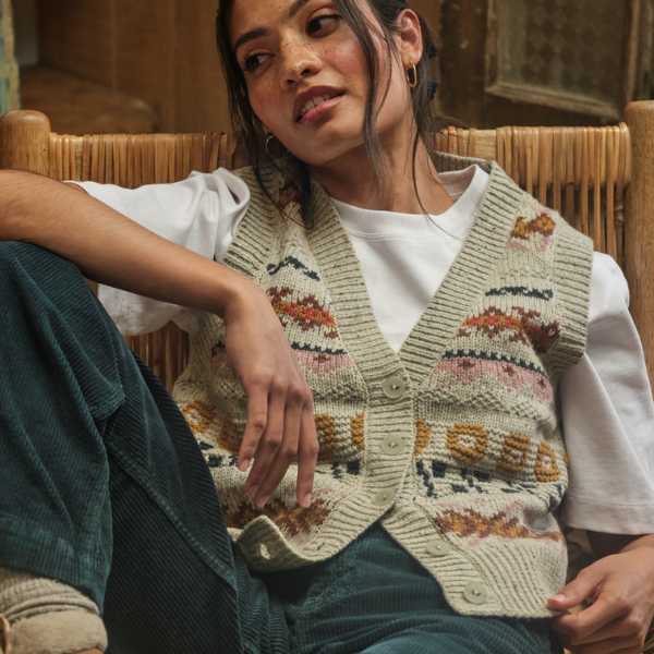 A model wears a knitted waistcoat