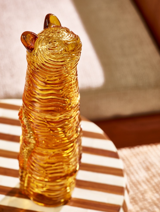 Abrown bear shaped glass