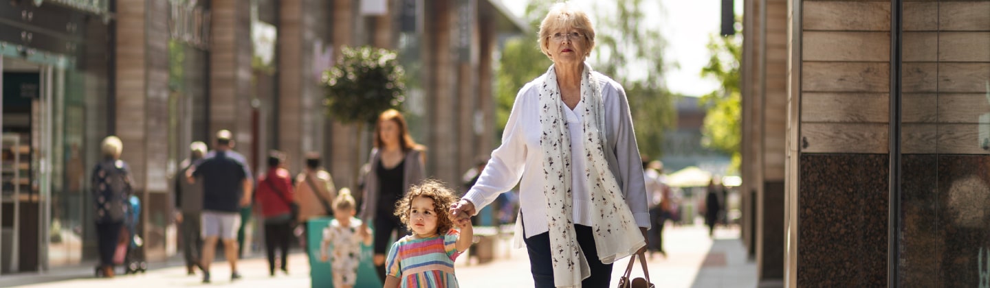 Elderly woman and child shopping