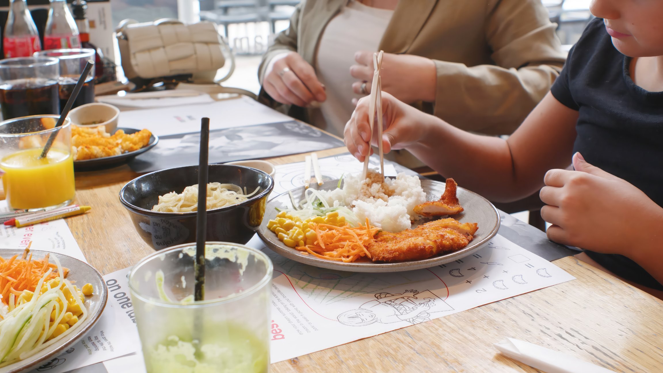 Two people eating katsu curry